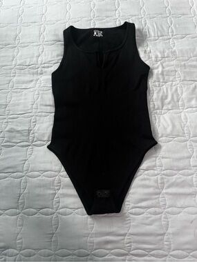 OQQ Black Ribbed One-Piece Bodysuit Sz M